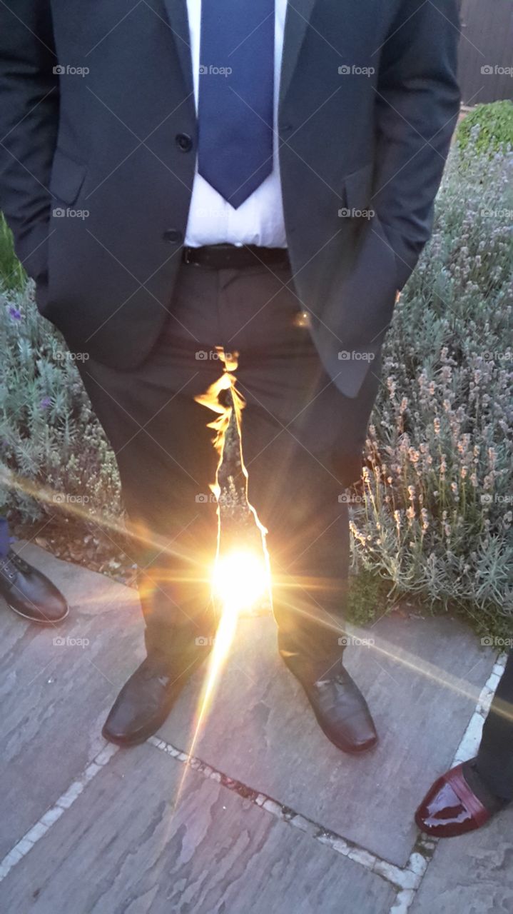 Bright Shining Light Between The Legs Of A Man In A Suit - Wedding Photos
