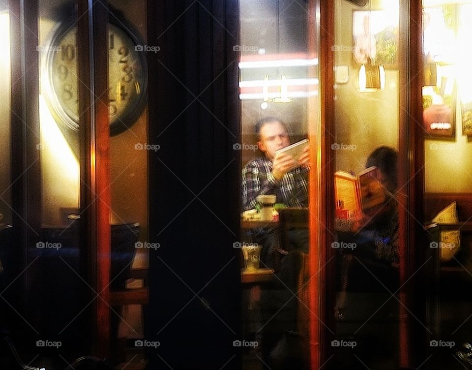 reading in a cafe