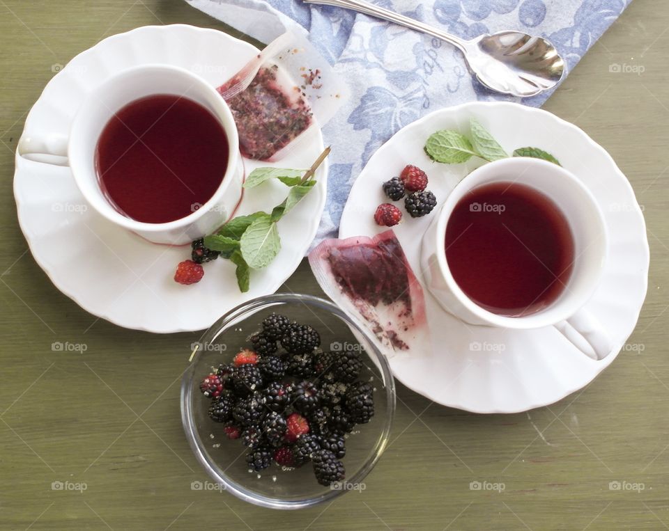 Raspberry tea in white cup