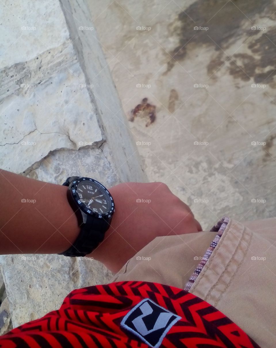 B.U.M. wristwatch, red and black stripe shirt
