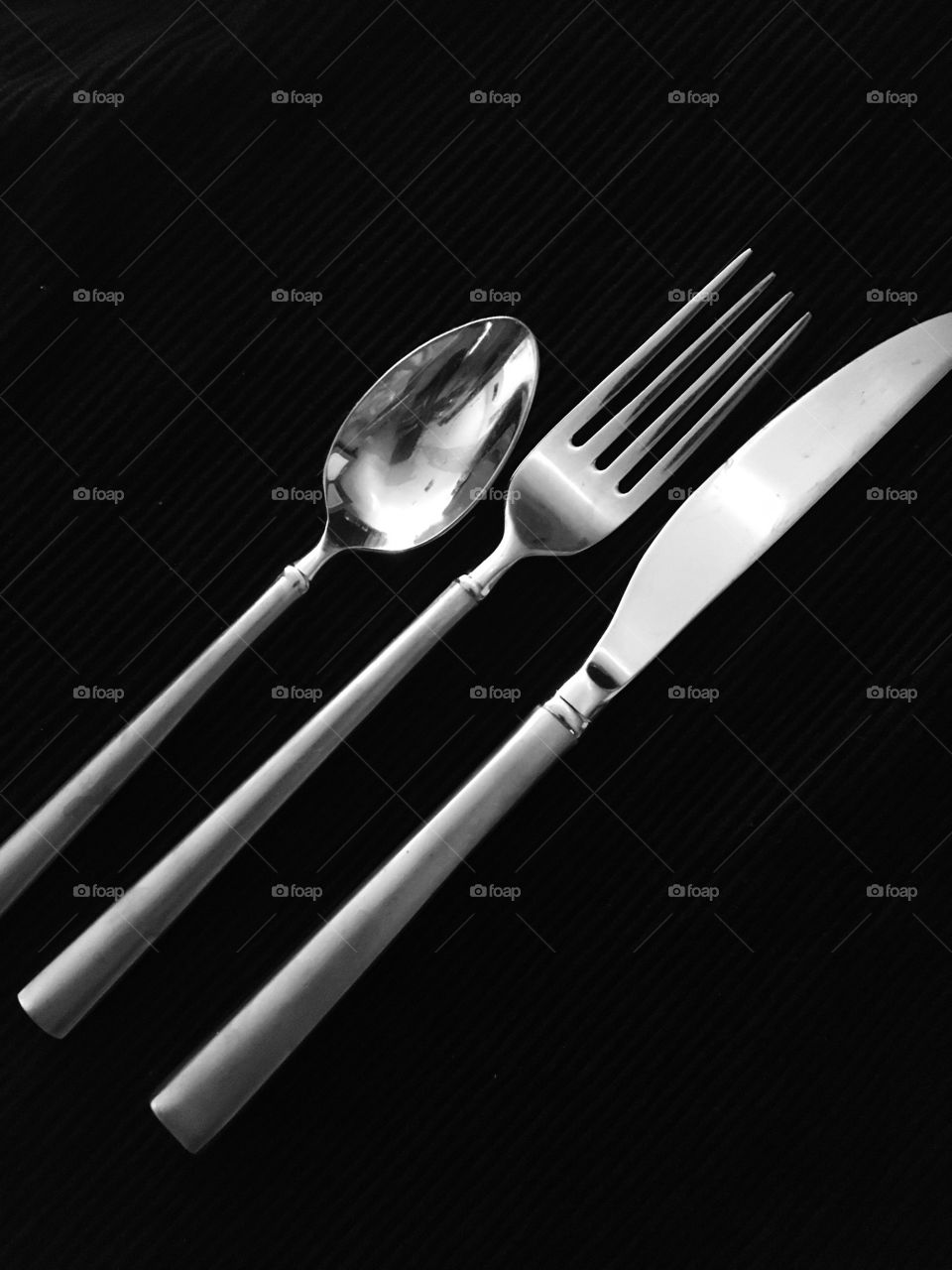 Kitchen utensils on black background
