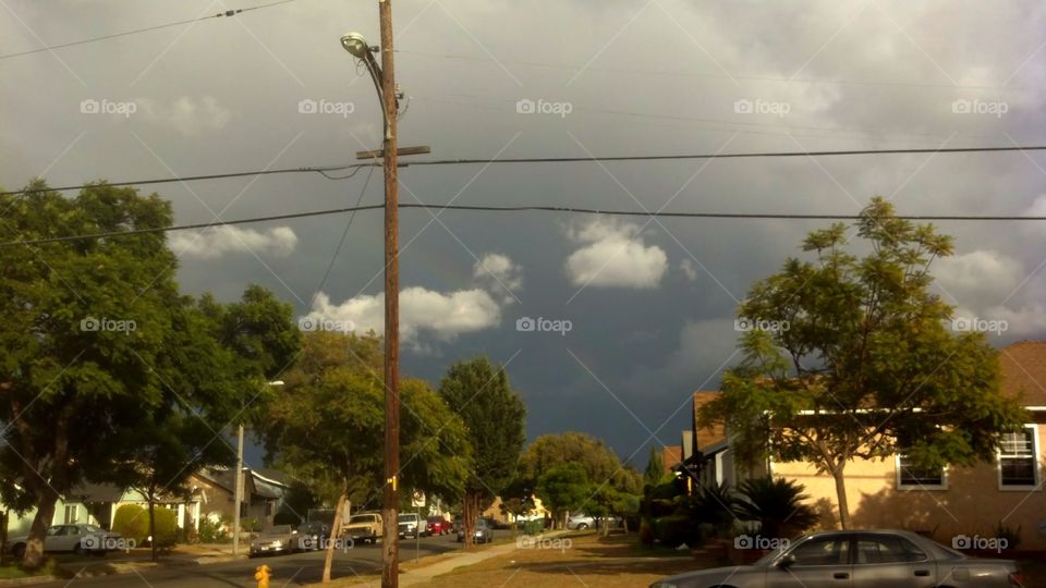 rainbow in dark clouds