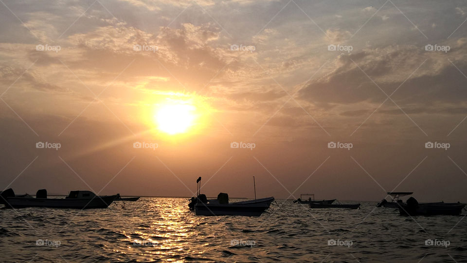 Local fishermen boats in sunset