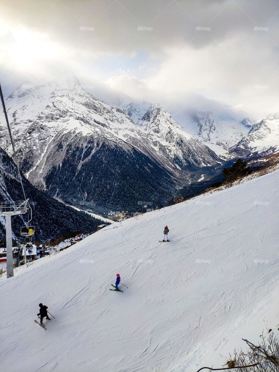 Skiers on a mountain slope