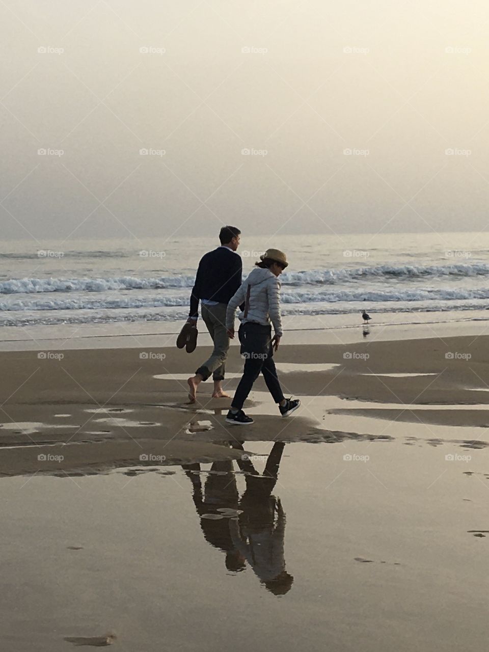 A couple walking together in the evening light