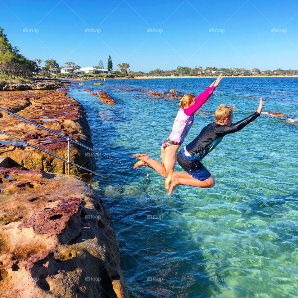 Jumping into the rock pool 