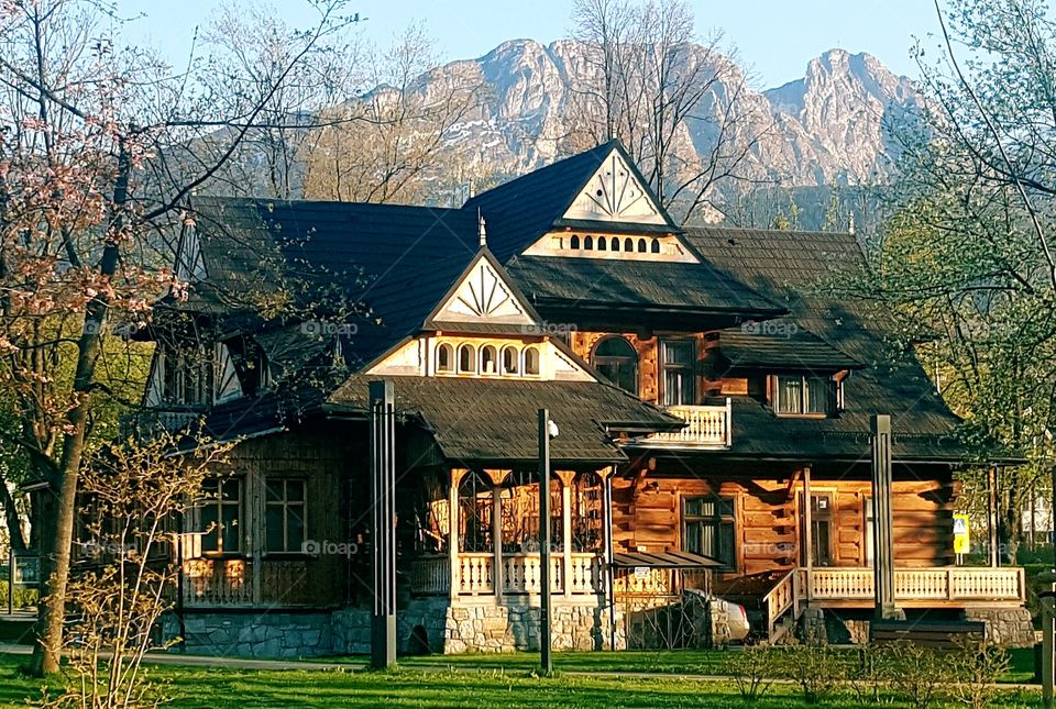 house below the mountain