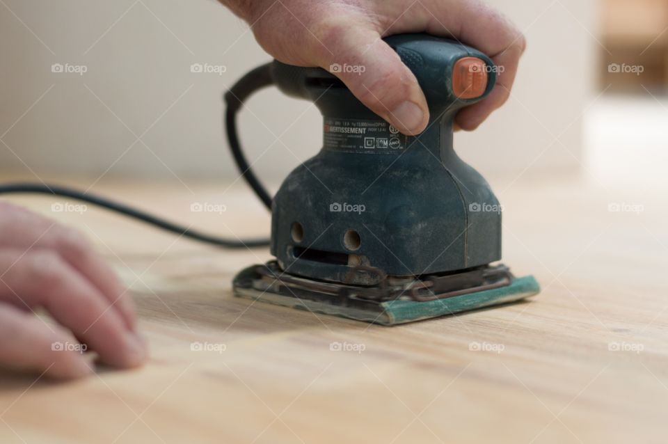 Sanding wood floor. Sanding a wood floor in preparation for refinishing.