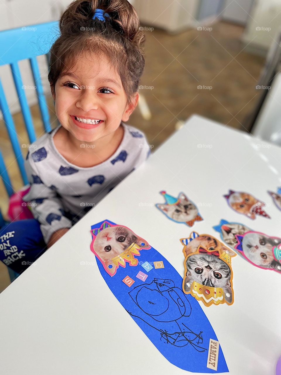 Little girl does homework from school, preschool child does craft with Mommy, making feathers for Thanksgiving, classroom crafts 