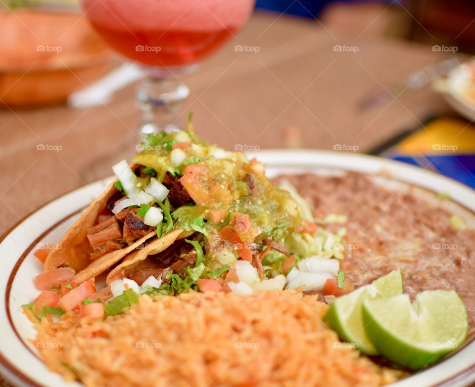  Delicious Rice,beans,And Tacos on a plate with a Margarita 
