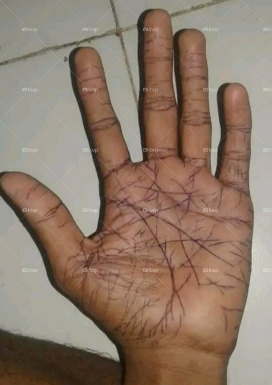 The hand of a laborer working in our house.