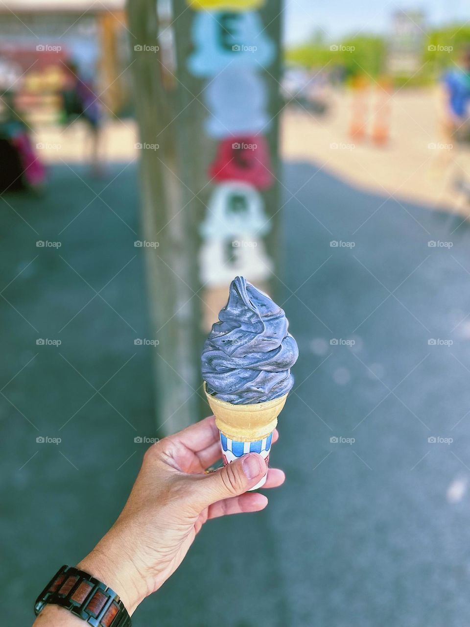 Woman holding ice cream cone, eating ice cream in the summertime, ice cream at Hidden Valley Orchard, eating homemade ice cream