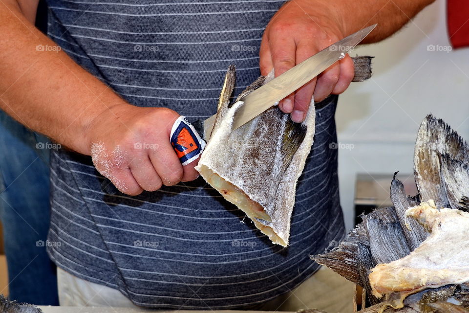 Close-up of a man gutting fish