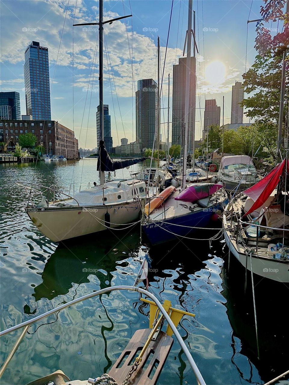 This is “Newtown Creek” with its great variety of boats seen from aboard “Salvation”, a “28 foot 1969 Luhrs” cabin cruiser by the “Pulaski Bridge” in LIC, Queens on a beautiful sunny evening in May 2024. Hypnotic Productions