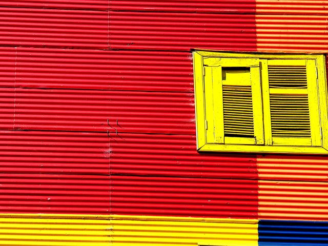 yellow window in a colourful building