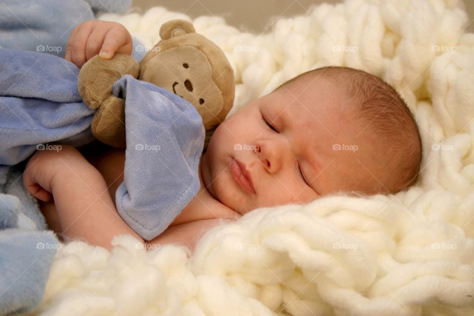 Cute baby sleeping on cotton