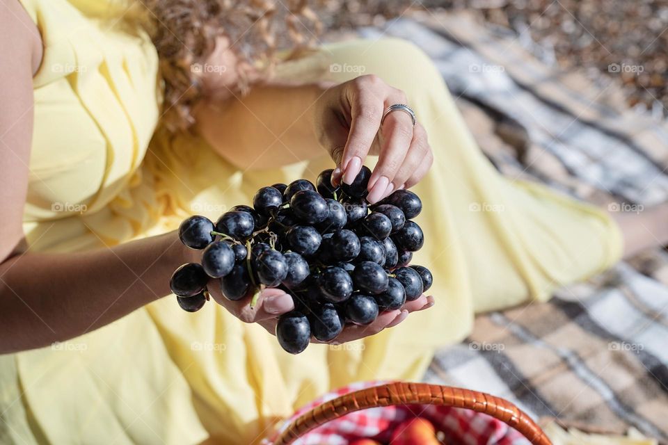 woman eating grapes