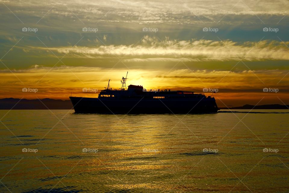 Silhouette of a boat at sunset