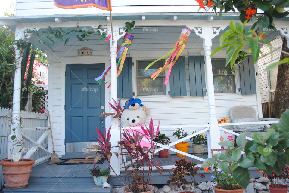 A cute teddy bear at the porch of a house in Key West, Florida