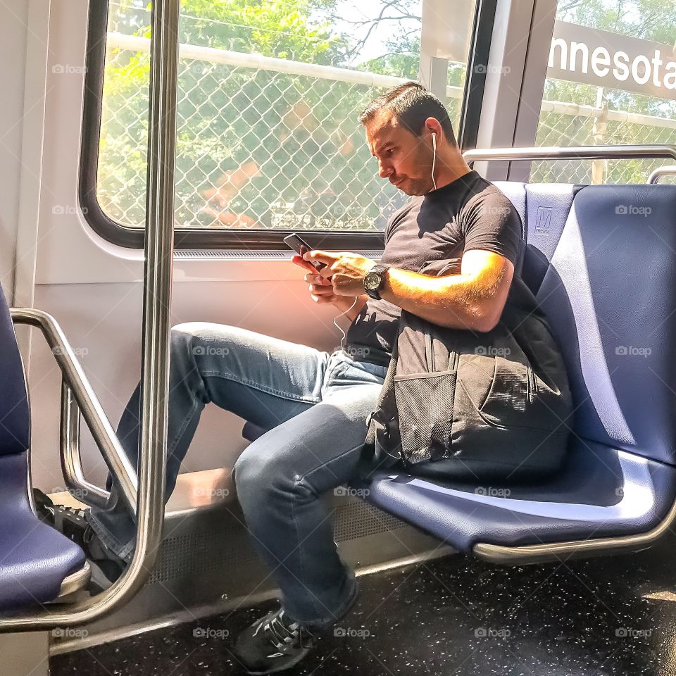 Man waiting at the Minnesota Avenue Metro stop. 