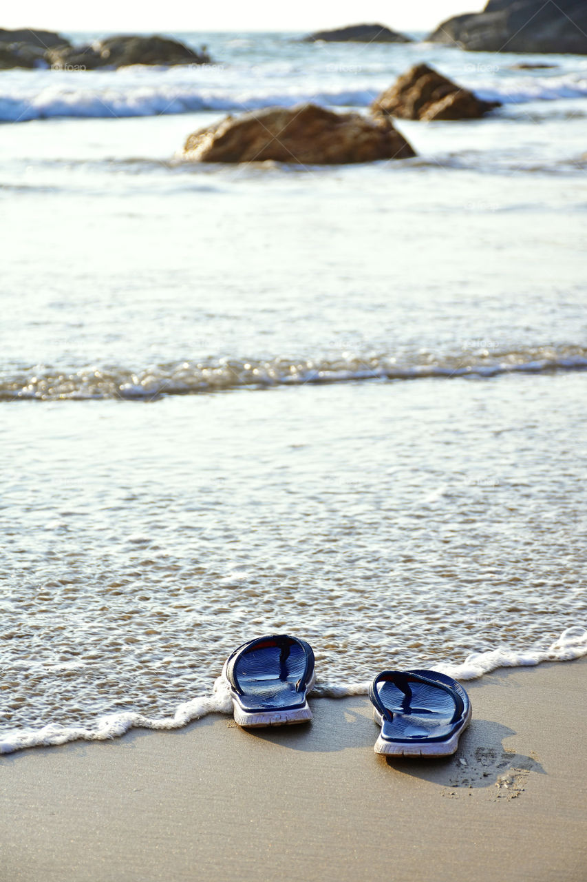 slippers in a beach