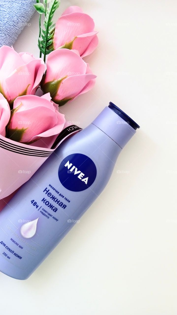 Nivea and roses on a white background