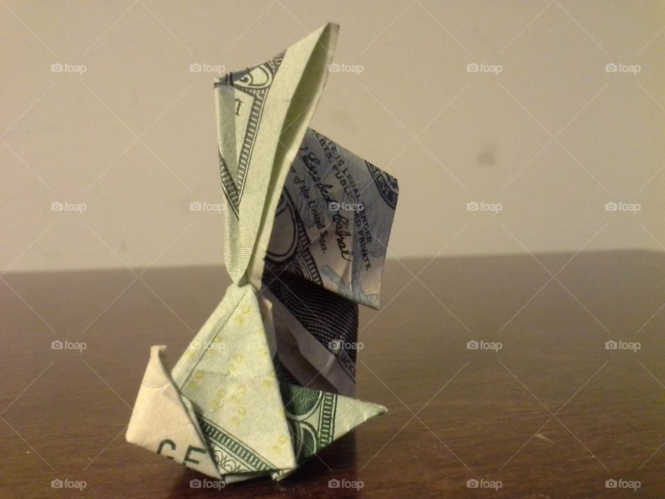 A small rabbit made out of a twenty dollar bill