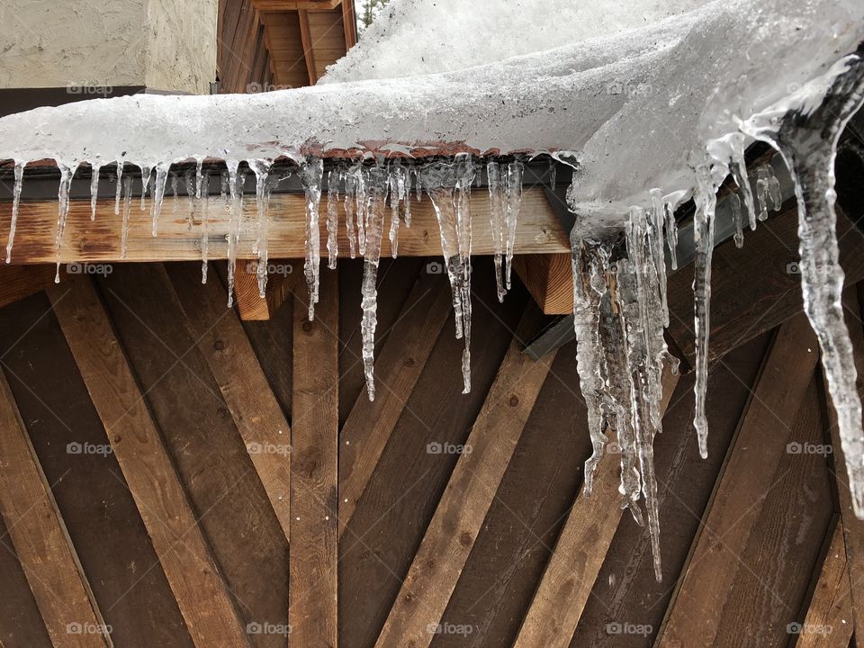 Icicles on an old, wooden ski lodge in the Montana Mountains. 