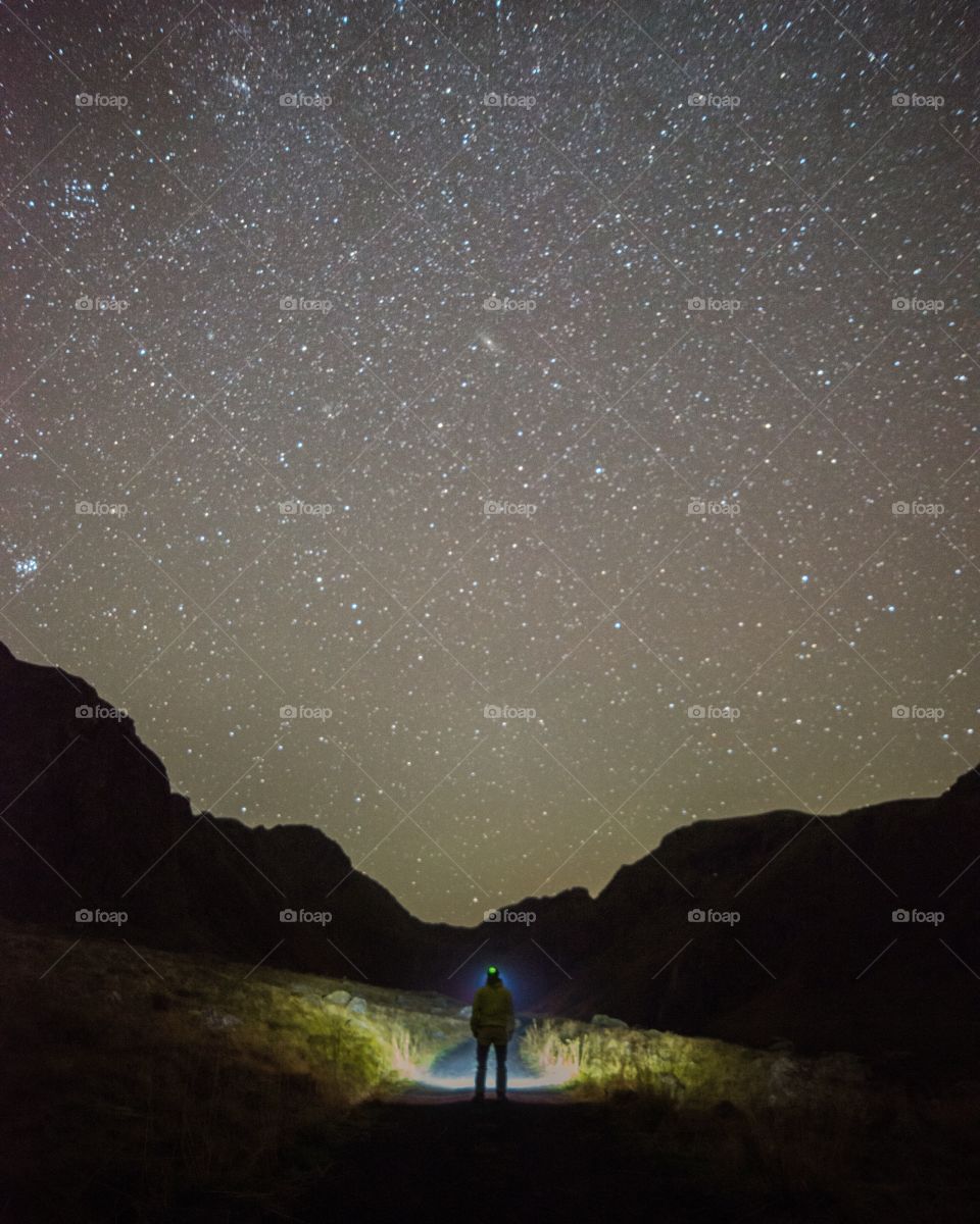 Rear view of a person stargazing