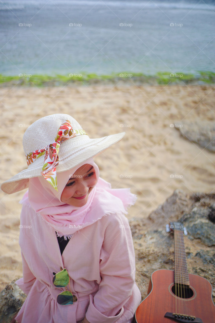 Beauty girl with hat at beach
