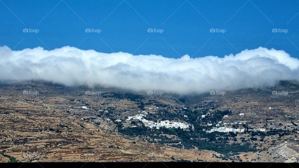 the view from the ship leaving the island Tinos