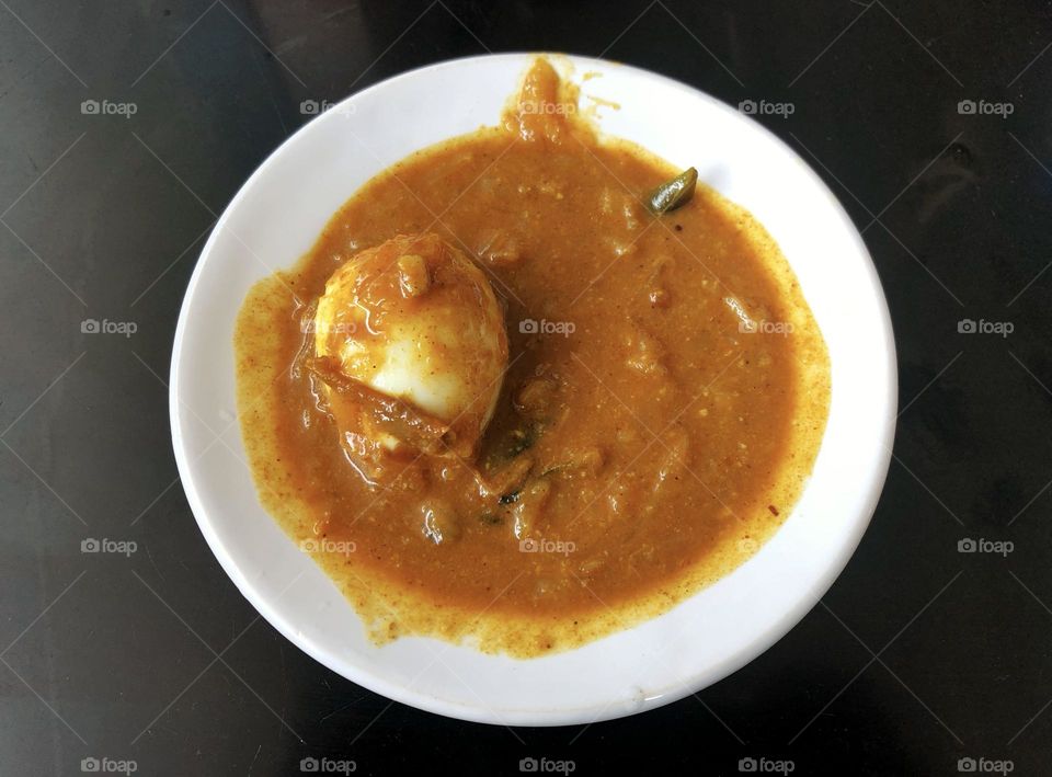 This hearty egg curry is perfect for a filling breakfast. The savory gravy and perfectly boiled eggs make this dish a delicious way to start your day.