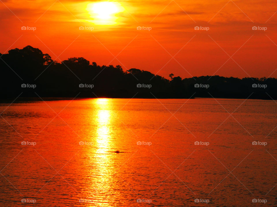 Sun reflecting on the lake at sunset