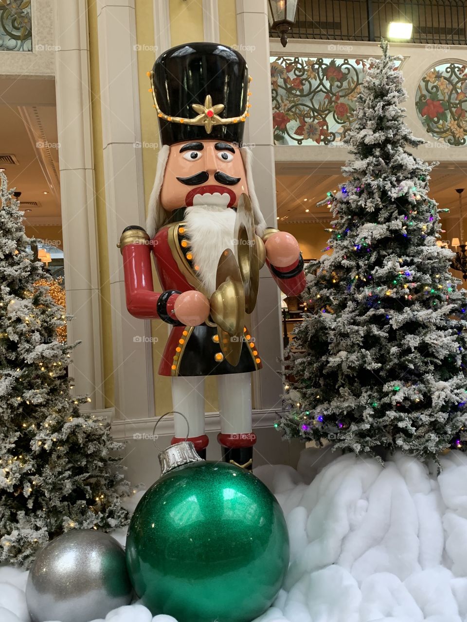 Decorating for Christmas. Large colorful decorations. The traditional colors of Christmas are pine green (evergreen), snow white, and heart red. Blue and white are often used to represent winter