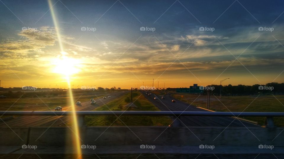 Highway sunrise. the sun rising over highway 190 through fort hood
