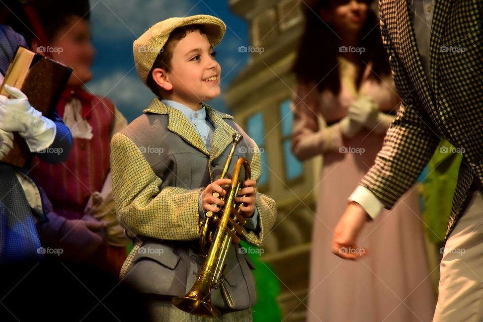 Close-up of a boy holding saxophone