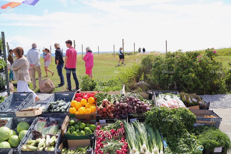 People by the foodmarket in the small village by the sea