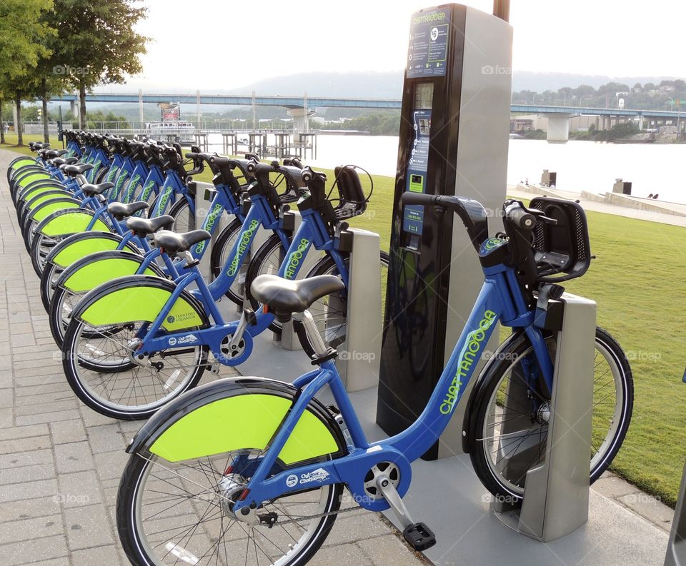 Bike anyone?. A row of rental bikes by the river