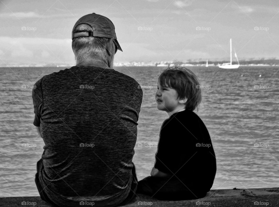 Boy With Grandfather. Young Boy And Grandfather On San Francisco Bay
