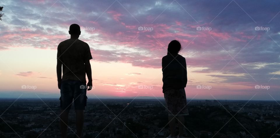 A man and a woman meet the sunrise
