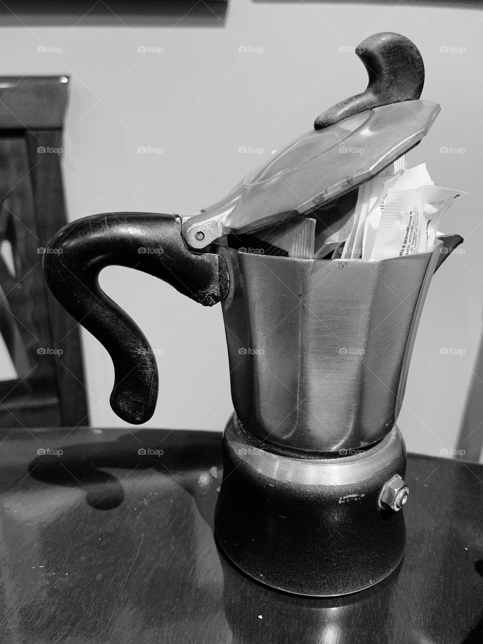  old coffee pot reused as a sugar sachet holder