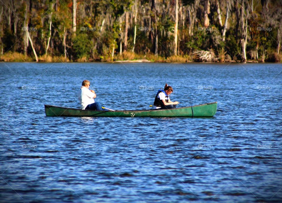 Father and daughter canoeing 