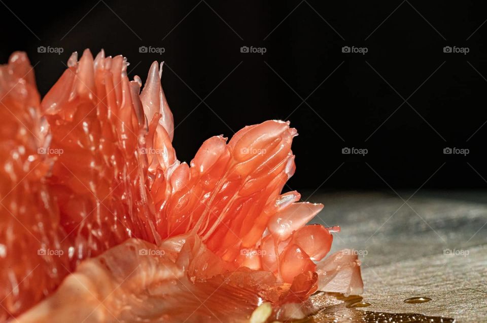 closeup grapefruit pulp with thin peel and juicy granules