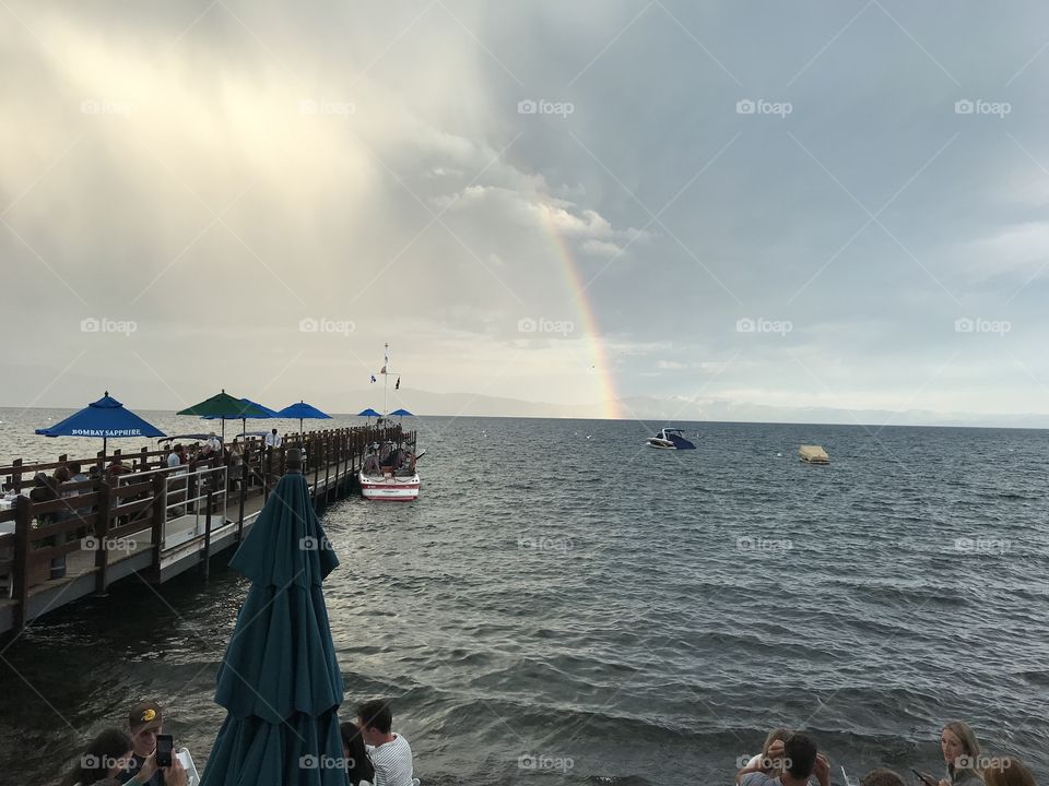 Rainbows diving into Lake Tahoe on a stormy summer afternoon. 