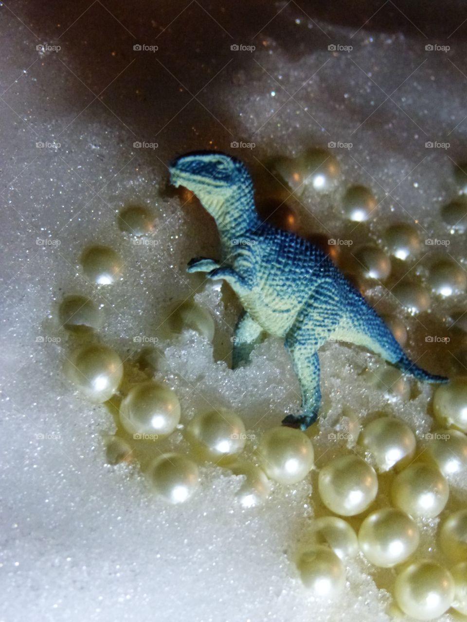 dinosaur in snow and pearls