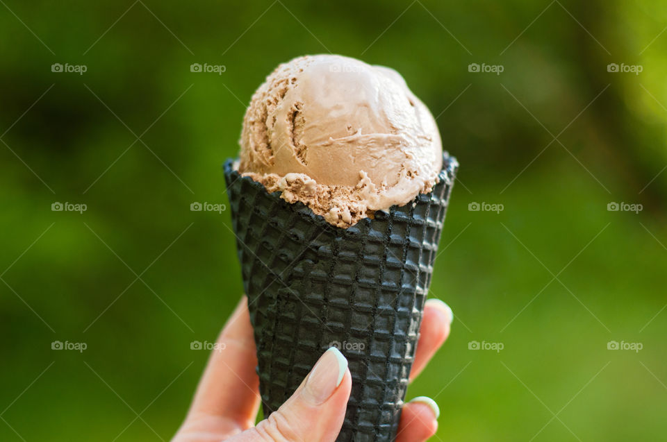 Chocolate ice cream in hand