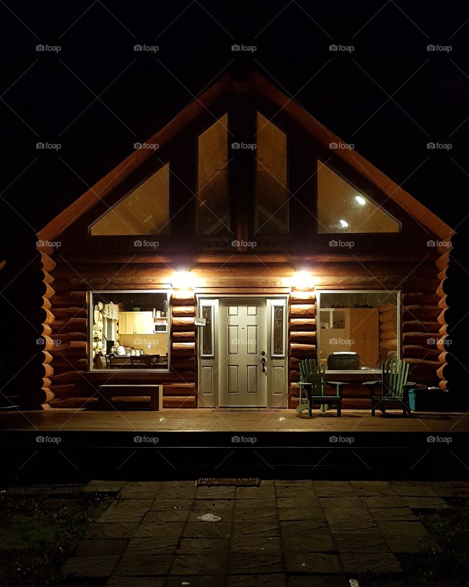 log cabin at night