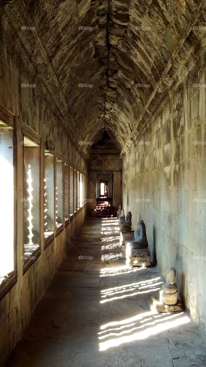Peaceful hallway sunlight through windows hall of buddhas angkor wat cambodia
