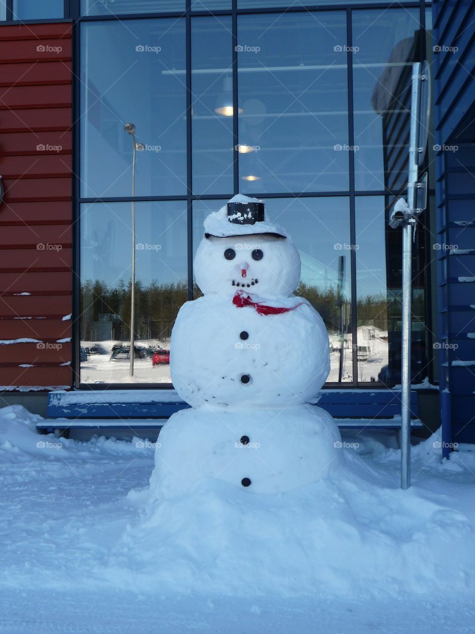 Snowman in front of an Airport 