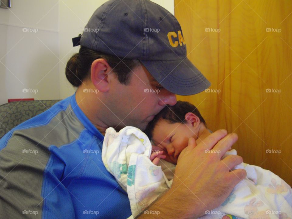 Father Holding Newborn Son
